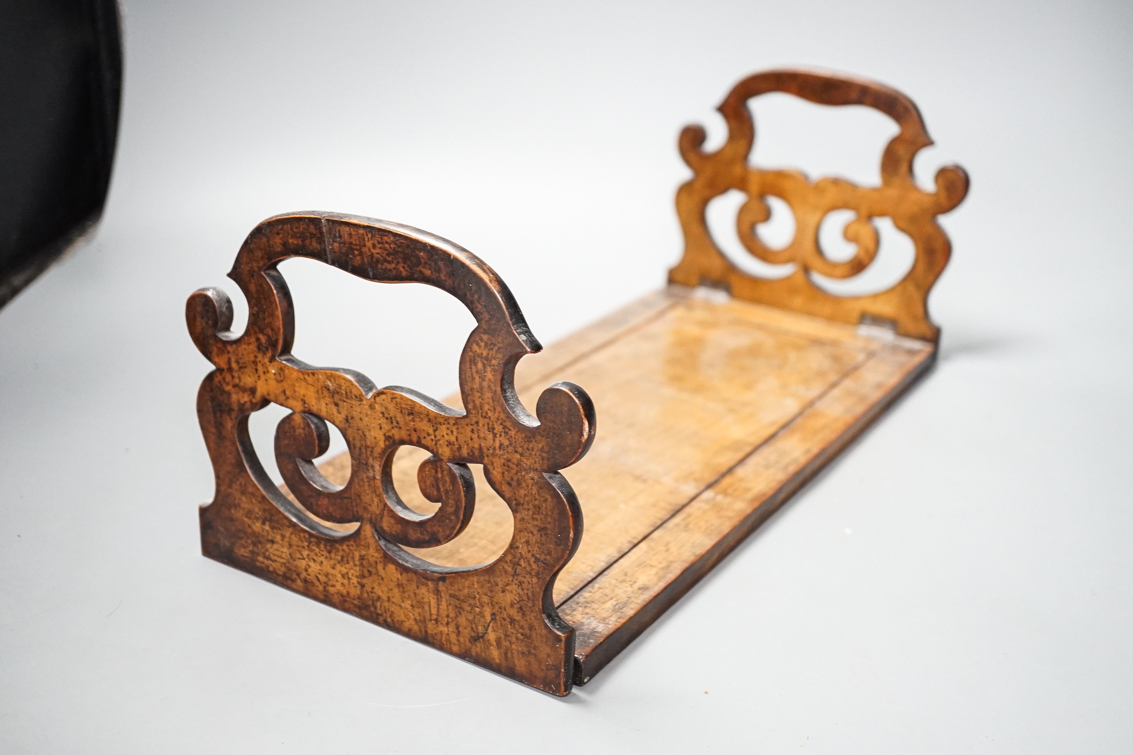 A Victorian walnufolding bookslide and an inlaid mahogany tray, largest 40cms wide.